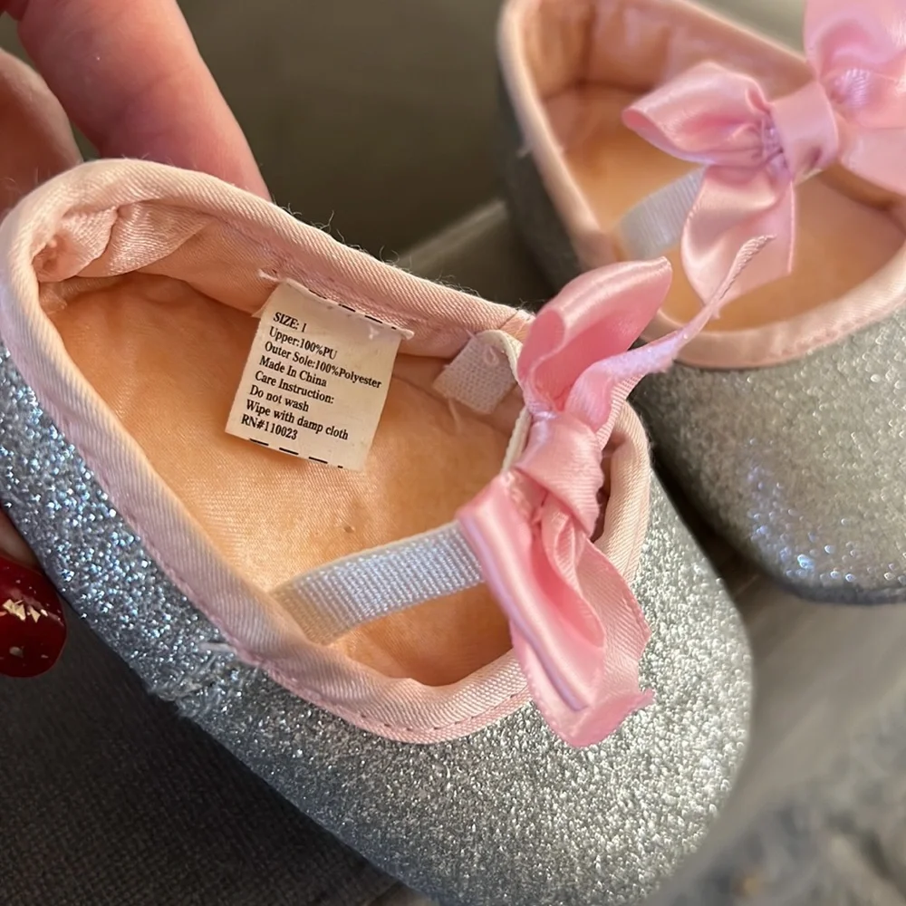 Silver flat shoes with pink bows. Baby Girl Size 1